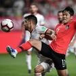 South Korea's Na Sang-ho (red shirt) fights for the ball against Iran's Morteza Pouraliganji during their friendly international in Seoul on June 11, 2019. The match ended 1-1