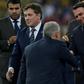Brazil coach Tite (center) shakes hands with Brazilian President Jair Bolsonaro (right) after leading his team to Copa America glory