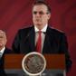 Mexican President Andres Manuel Lopez Obrador (L) listens to Foreign Minister Marcelo Ebrard during a press conference in Mexico City on an immigration deal with the US