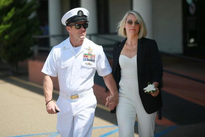 Navy Special Operations Chief Edward Gallagher walks out of military court with his wife Andrea as the jury deliberates in his war crimes trial, on July 2, 2019 in San Diego, California