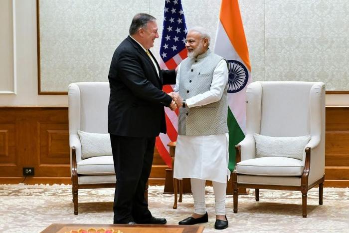 US Secretary of State Mike Pompeo shakes hands with Indian Prime Minister Narendra Modi during their meeting