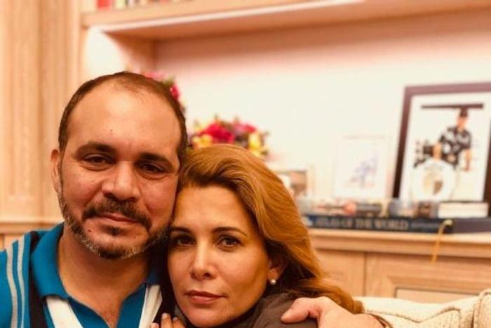 This handout picture released on the Twitter page of Jordan's Prince Ali Al Hussein on July 31, 2019 shows him, the half brother of King Abdullah and the president of the Jordanian Football Association, hugging his sister Princess Haya (R) at an undisc...