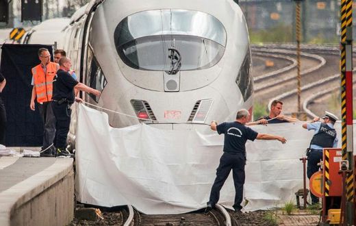An Eritrean man has been charged with murder and attempted murder for pushing a mother and her son in front of a train as it arrived in Frankfurt