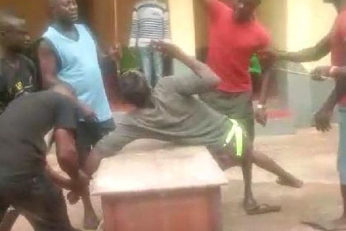 The young man captured being beaten for flouting the chief’s orders