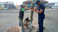 Police officer Lance corporal Simon Agbeko repairs broken traffic light at Odorkor