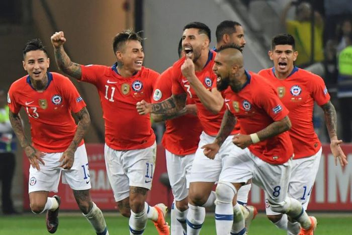 Chile players celebrate after defeating Colombia in a penalty shoot-out after a 0-0 draw in their Copa America quarter-final match in Sao Paulo, Brazil