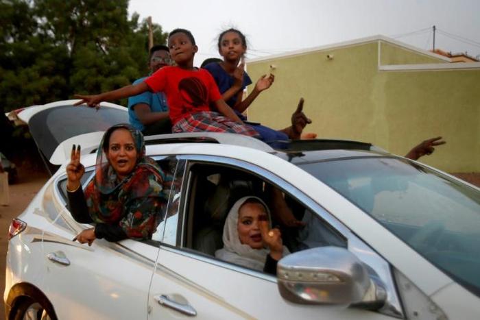 Convoys of vehicles honking horns took to the streets of Khartoum as Sudanese celebrated a hard-won deal between protest leaders and the ruling generals aimed at drawing the line under months of political unrest