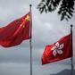 China's national flag is seen beside the Hong Kong ensign a day after protesters broke into the government headquarters in the city