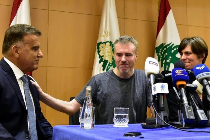 Canadian Kristian Lee Baxter (C) was released from Syrian detention with help from Lebanese authorities