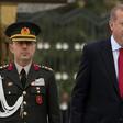 The court handed down an aggravated life sentence for "violating the constitution" to Colonel Ali Yazici (L), former military aide to Erdogan (R)