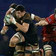 Argentina's Jaguares lock Guido Petti (L) runs with the ball past Japan's Sunwolves lock Mark Abbott during their Super Rugby match at Jose Amalfitani stadium in Buenos Aires, on June 14, 2019.