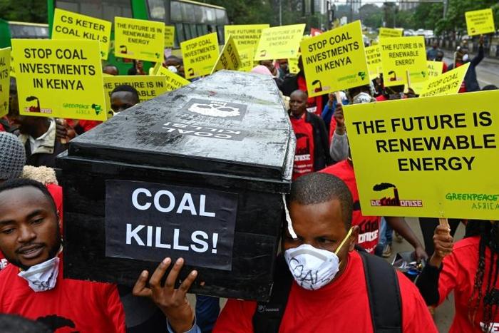 Protesters march in downtown Nairobi to demonstrate against a coal-fired power station planned for Kenya's heritage-listed Lamu archipelago
