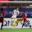 Kashima's Serginho scores the only goal past Hiroshima's goalkeeper Hirotsugu Nakabayashi on Tuesday