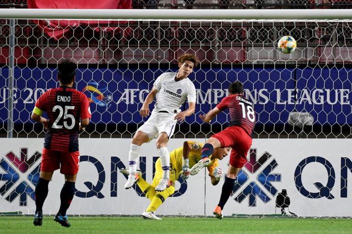 Kashima's Serginho scores the only goal past Hiroshima's goalkeeper Hirotsugu Nakabayashi on Tuesday