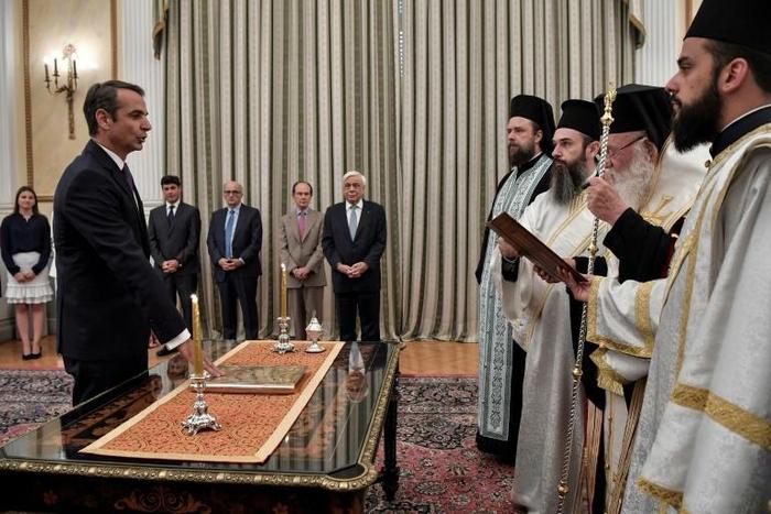 Greece's new Prime Minister Kyriakos Mitsotakis is sworn in on the bible, in contrast to his atheist predecessor