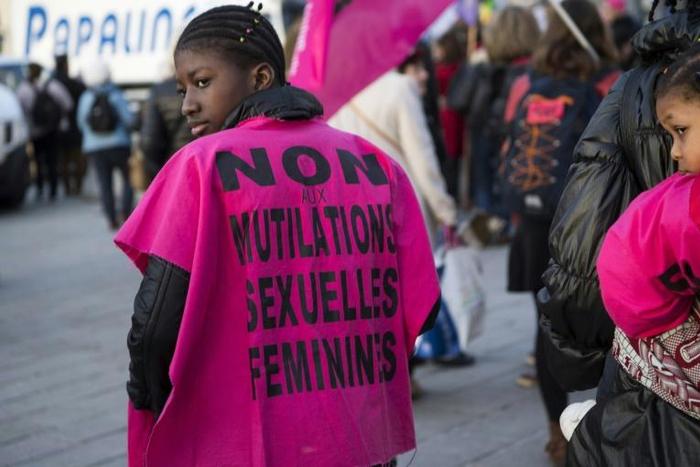 A woman wears a jersey reading, "No to female genital mutilation" during a demonstration in 2018