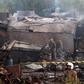 Pakistani soldiers cordon off the site where an aircraft crashed in Rawalpindi