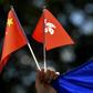 Chinese and Hong Kong flags are waved during a march Sydney