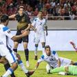 Costa Rica's Bryan Oviedo, in the dark jersey, scores a goal against Nicaragua in Sunday's Gold Cup match