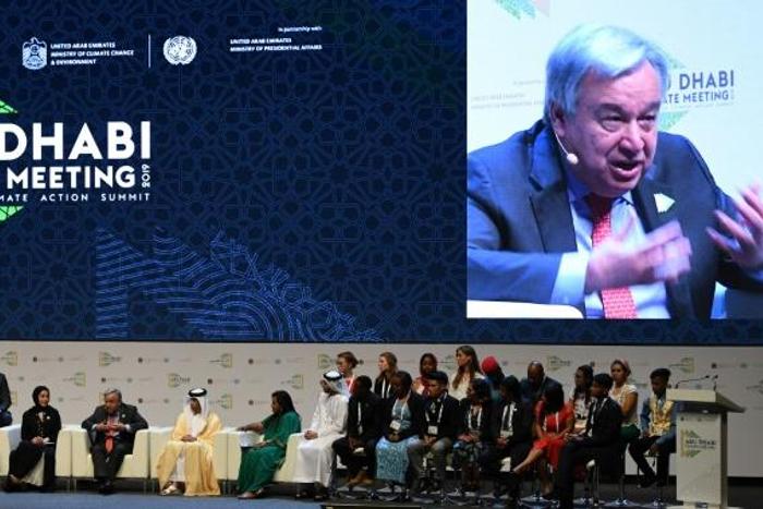 UN Secretary General Antonio Guterres (C) and Emirati ministers chair a panel at the Abu Dhabi climate meeting in Abu Dhabi