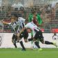 Udinese's Brazilian defender Rodrigo Becao (C) celebrates after scoring against AC Milan