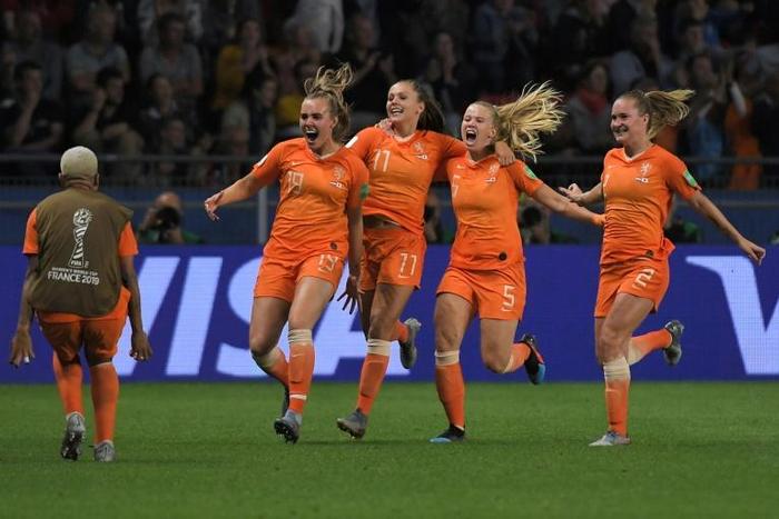 Netherlands players celebrate after Lieke Martens' late penalty gave the European champions a 2-1 win over Japan to take them into the last eight