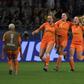 Netherlands players celebrate after Lieke Martens' late penalty gave the European champions a 2-1 win over Japan to take them into the last eight