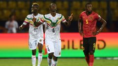 Amadou Haidara (C) celebrates scoring for Mali against Tunisia in Ismailia