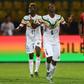 Amadou Haidara (C) celebrates scoring for Mali against Tunisia in Ismailia