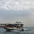 A picture taken on July 21, 2019, shows Iranian Revolutionary Guards patrolling around the British-flagged tanker Stena Impero anchored off the Iranian port city of Bandar Abbas