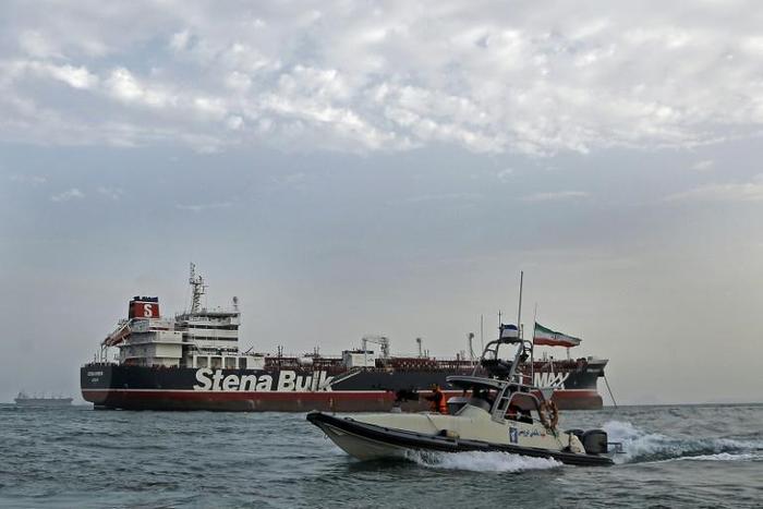 A picture taken on July 21, 2019, shows Iranian Revolutionary Guards patrolling around the British-flagged tanker Stena Impero anchored off the Iranian port city of Bandar Abbas