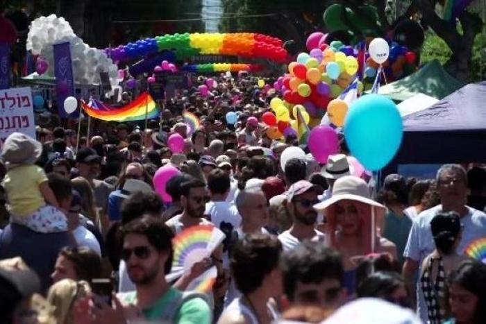 Men and women in colourful costumes, including several dressed as samba dancers, paraded through the streets on motorised floats or sashayed alongside