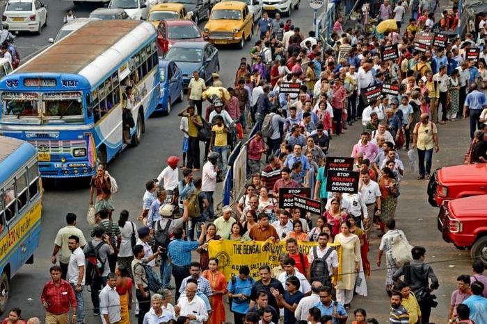 Medical professionals rally against violence in the workplace in West Bengal's capital Kolkata on Friday