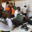 The officials were unhappy that the journalists were interviewing some frustrated applicants