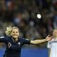 Eugenie Le Sommer celebrates her decisive penalty for France
