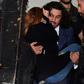 The woman who has accused Brazilian football star Neymar of rape, Najila Trindade Mendes de Souza, is carried out of a Sao Paulo police station by her lawyer Danilo Garcia de Andrade -- he has now abandoned her as a client