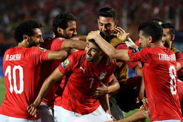 Mahmoud 'Trezeguet' Hassan (C) celebrates scoring the opening goal of the Africa Cup of Nations in Egypt