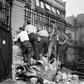 French Resistance fighters take position behind a wall in August 1944 during the battle for the liberation of Paris from Nazi occupation during World War II