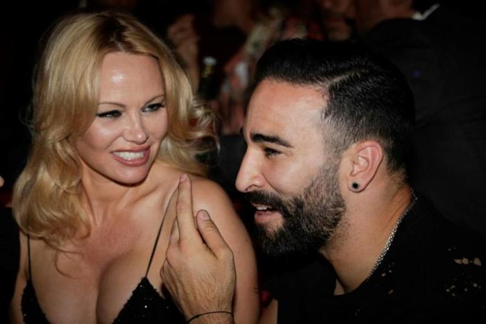 Pamela Anderson and France World Cup-winning player Adil Rami at the Crazy Horse cabaret in Paris on June 3