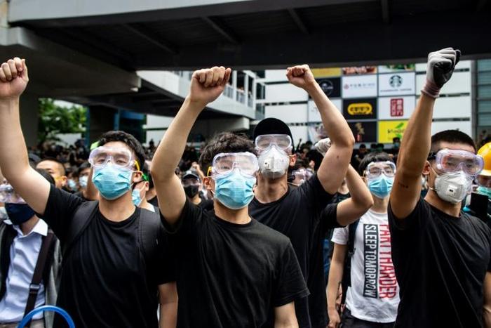 Hong Kong protesters have donned masks and goggles, both to protect themselves against tear gas and shield their identity