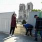 Barriers were set up as a truck delivered pipes and pumps for cleaning the esplanade in front of Paris' great medieval cathedral