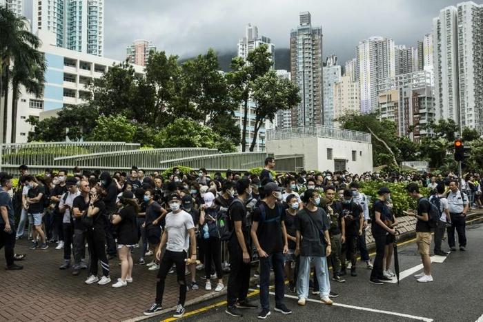 Demonstrators gathered outside the Eastern district court in Hong Kong in support of protesters who have been charged with rioting during recent clashes