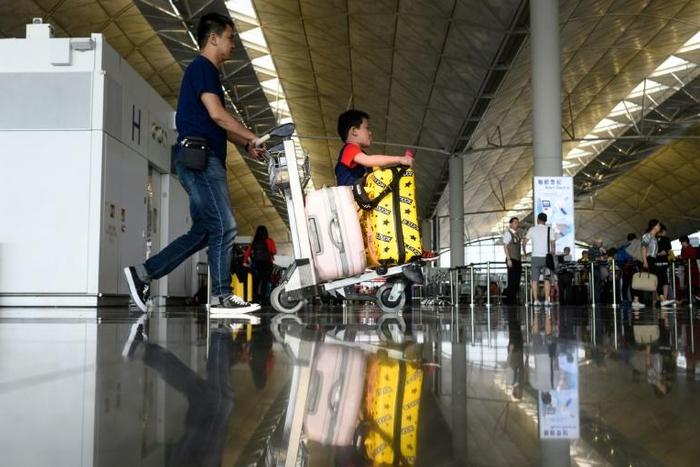 Hundreds of flights remained cancelled on Tuesday after a mass rally at Hong Kong's airport on Monday