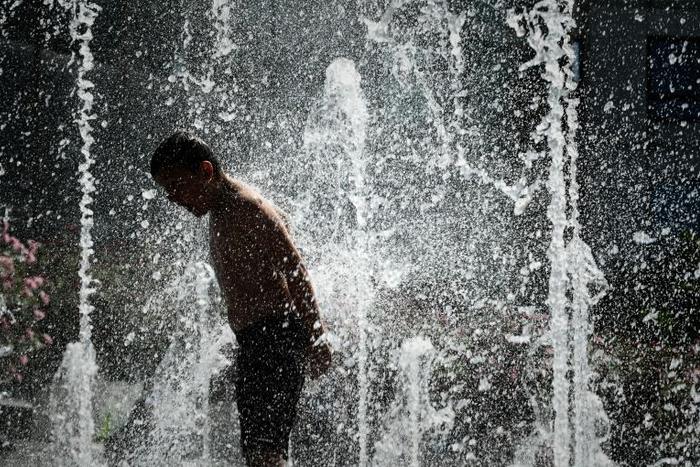 Paris fountains are fair game to cool down during the heatwave