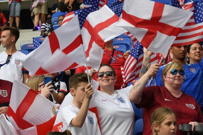 England supporters cheer before the Women's World Cup semi-final football match against the USA