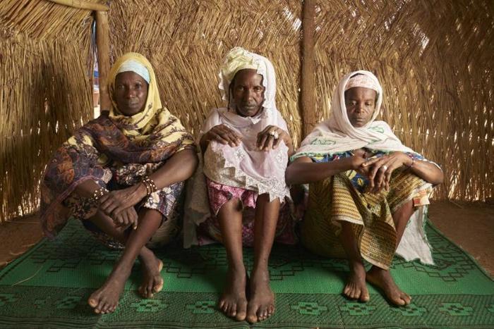 Vellara Barry, 45, Dienaba Barry 43, and Fatoumata Ousmane Barry 45, pictured in May after taking refuge in a displaced persons camp in Bamako amid a spate of violent attacks which have killed dozens