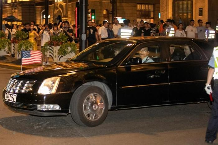 A consulate car carrying members of the US trade delegation leaves the Peace Hotel in Shanghai