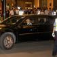A consulate car carrying members of the US trade delegation leaves the Peace Hotel in Shanghai