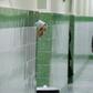 A prisoner peeks out at the hallway at Tehran's Evin prison in June 2006
