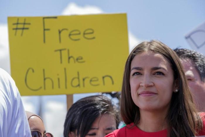 Democratic Representative Alexandria Ocasio-Cortez attends a press conference following a tour of migrant detention centers in Texas
